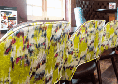 Bespoke pub furniture featuring bold fabrics, vibrant colours, and custom fixed seating by Jameson Seating